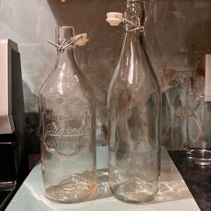 Set of 2 vintage glass, flip top bottles